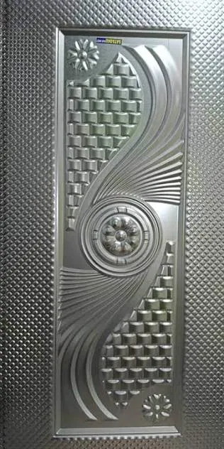 Moulded metallic-finish door skin panel with decorative embossed design