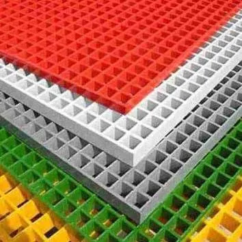 Stacked coloured FRP moulded grating panels showing a smooth gelcoat surface finish