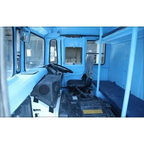 Interior of a moulded FRP commercial vehicle cab showing panel body finish