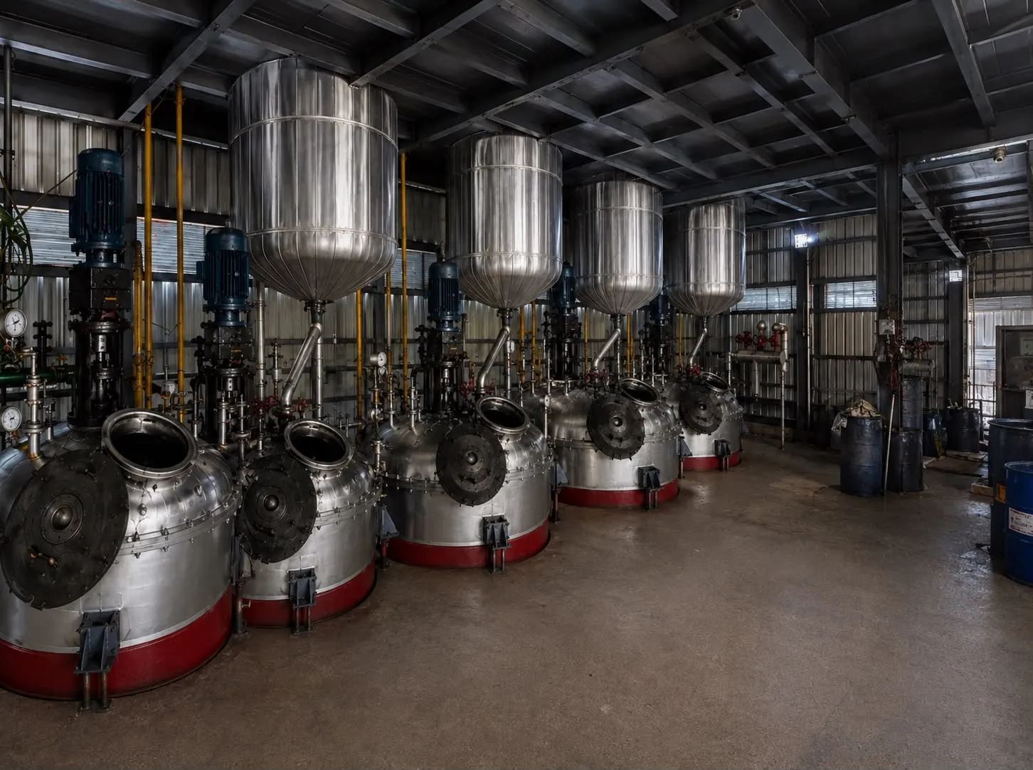 Stainless-steel resin processing reactors at the Samrat Poly Resins manufacturing facility